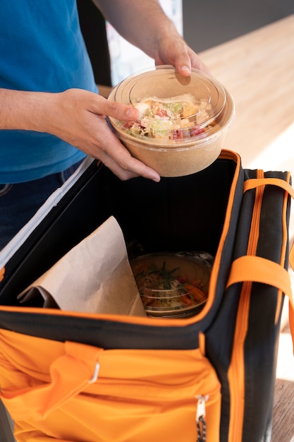 Man preparing takeaway food for delivery