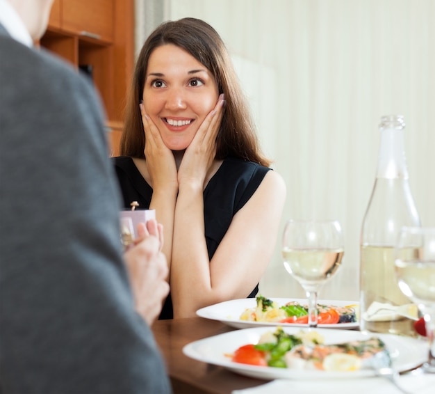 Man presents girl ring