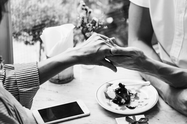 Man proposing girlfriend with diamond ring