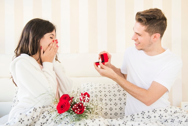 Man proposing to woman in morning