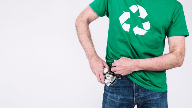 Man putting crumpled paper in his pocket