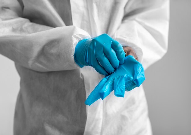 Man putting on protective equipment