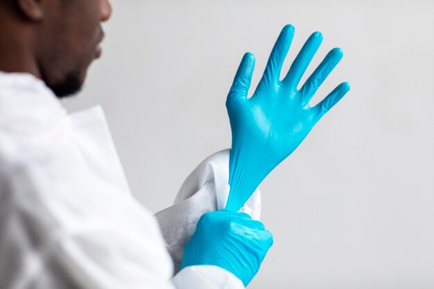 Man putting on protective equipment