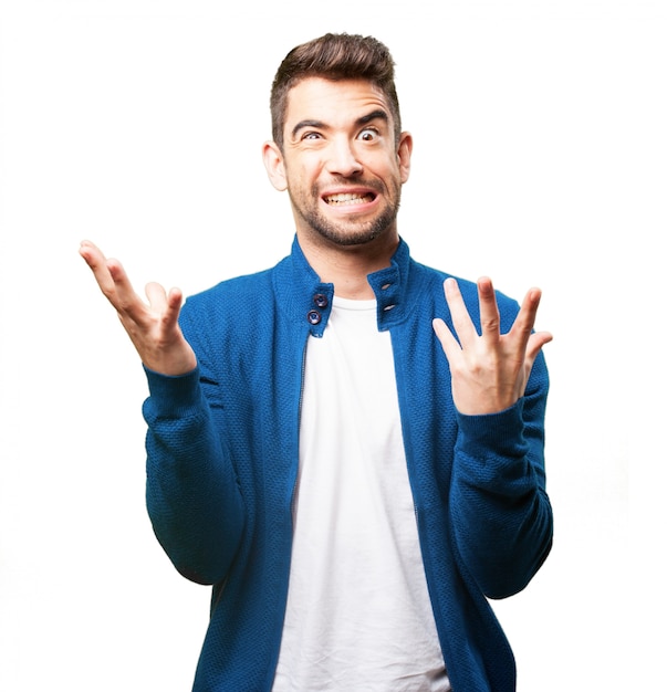 Man putting on a strange face and raised fingers