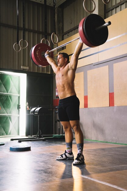 Man raising barbell