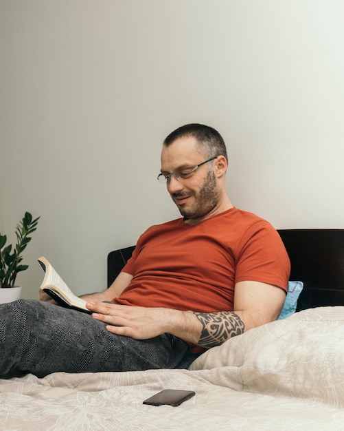 Man reading on bed