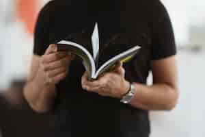 Free photo a man reading a book