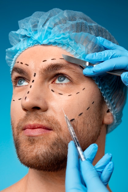 Free photo man receiving cosmetic enhancements