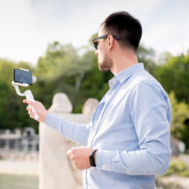 Man recording himself low angle