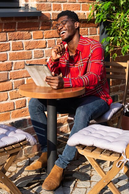 Man in red shirt laughing