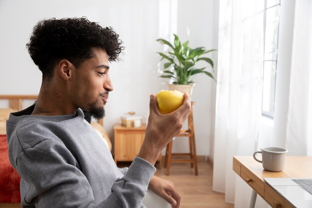 Man relaxing and eating breakfast