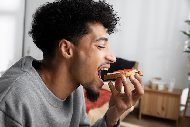 Man relaxing and eating breakfast