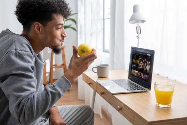 Man relaxing and eating breakfast