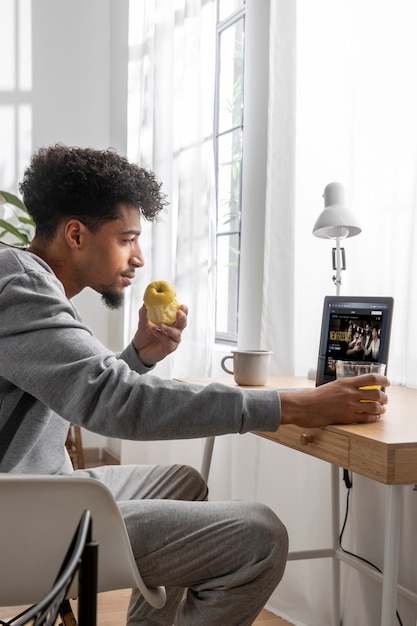 Man relaxing and eating breakfast