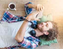 Free photo man relaxing on floor