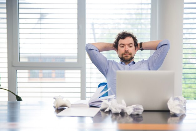 Man relaxing at working place
