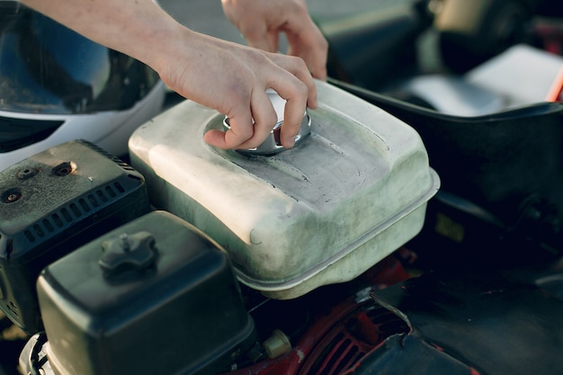 Man repairing engine of a car