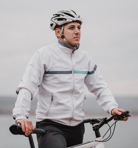 Man riding a bike on a cold day