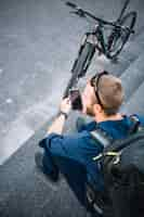 Free photo man riding bike