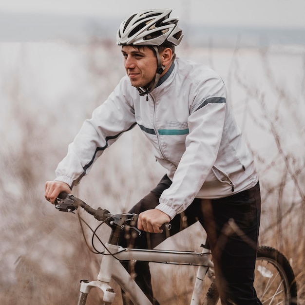 Man riding a mountain bike in special equipment