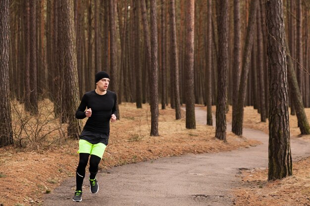 Man running in forest