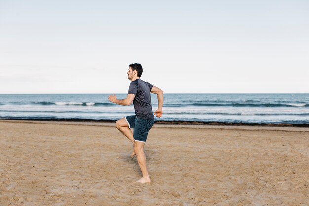 Man running on spot at beach