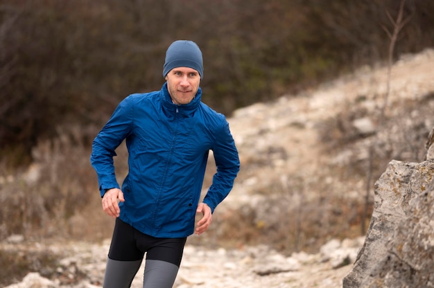 Free Photo | Man running on trail in nature