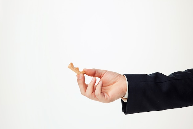 Man's hands holding wooden puzzle.