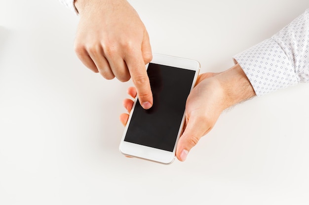 Man's hands using smartphone