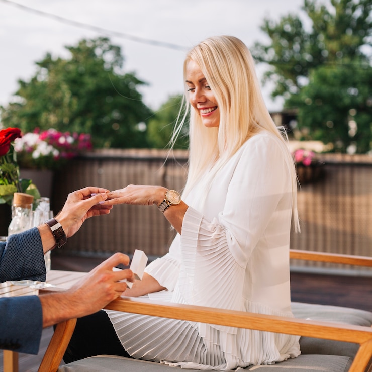 Free Photo man's placing wedding ring on woman's hand