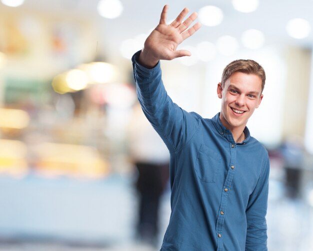 Man saying goodbye with his hand