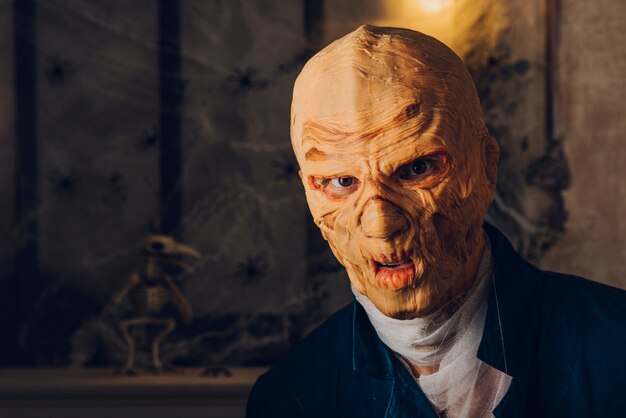 Man in scary mask posing in studio