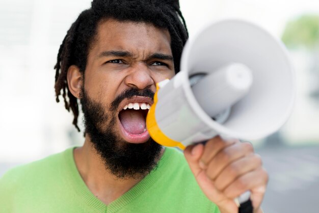 Man screaming black lives matter concept close-up