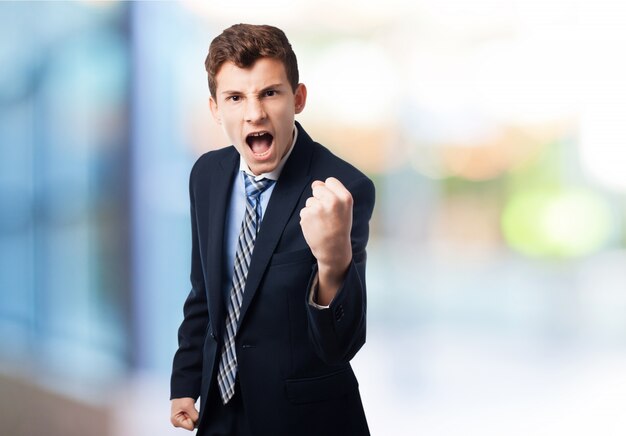 Man screaming with fists raised