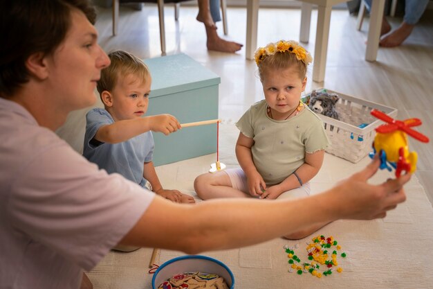 Man servant babysitting kids