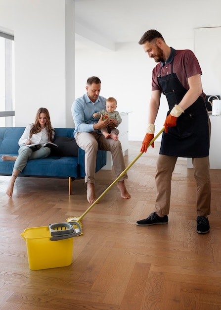 Man servant cleaning the house