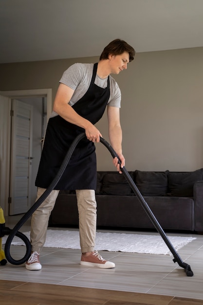 Man servant cleaning the house