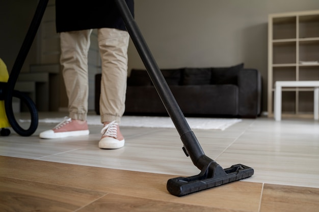 Man servant cleaning the house