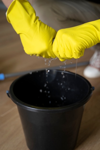 Free photo man servant cleaning the house