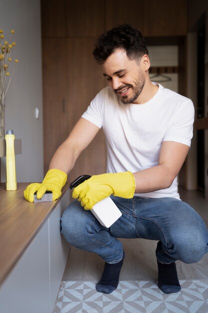 Man servant doing chores around the house