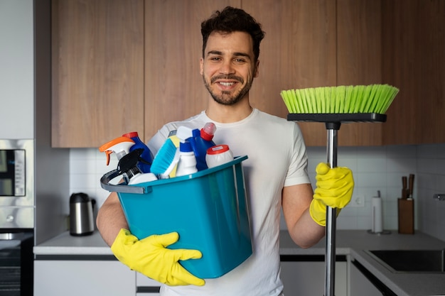 Free photo man servant doing chores around the house