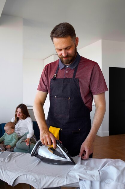 Man servant ironing clothing