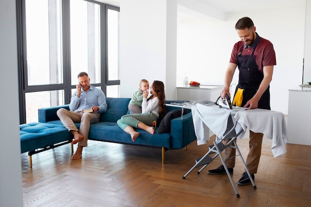 Man servant ironing clothing