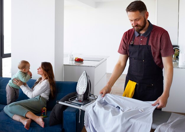 Man servant ironing clothing