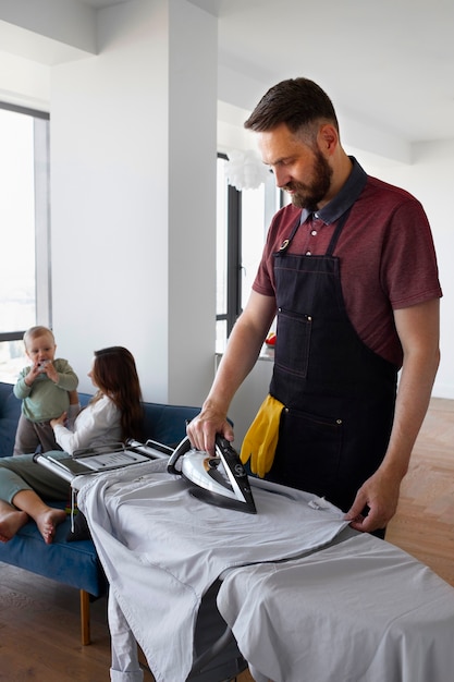 Man servant ironing clothing