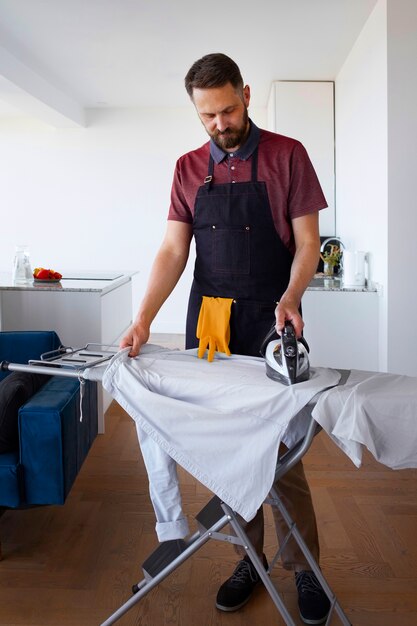 Man servant ironing clothing