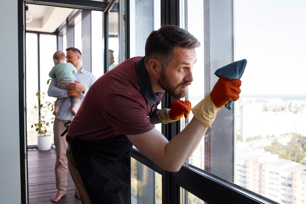 Man servant washing windows