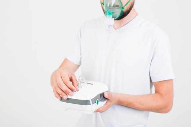 Man setting medical nebulizer