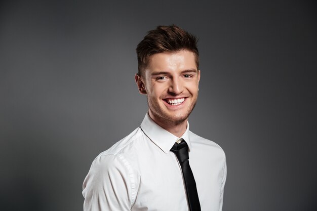 Man in shirt and tie standing 