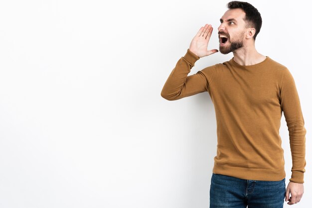 Man shouting while looking away